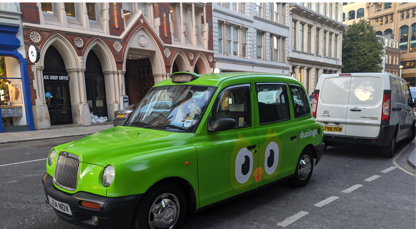 Custom green Duolingo branded London taxi