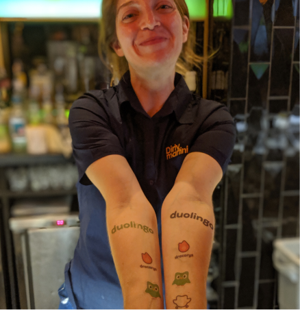 Bartender showing Duocon tattoos